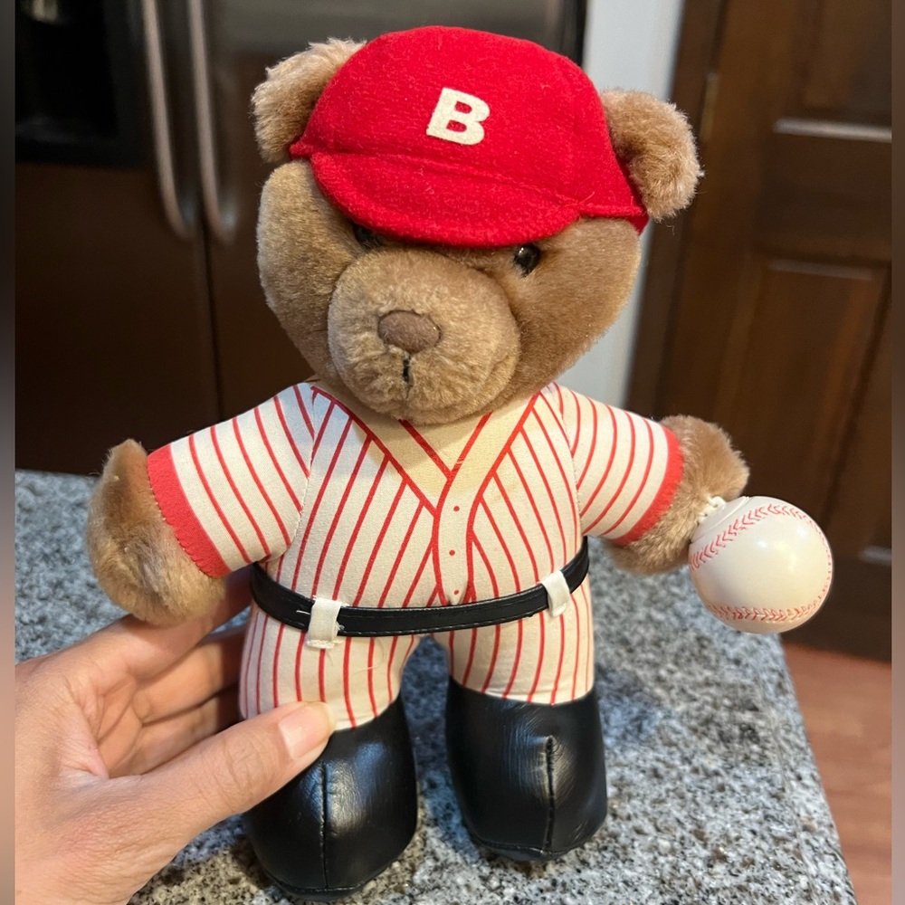 Red and white baseball player, bear stuffed animal